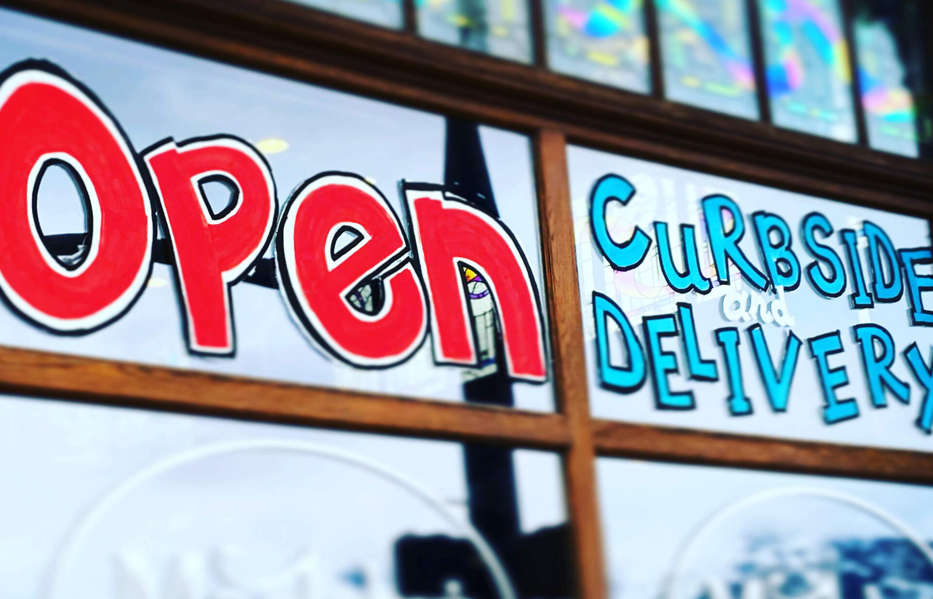 Wonky open sign window paint delivery