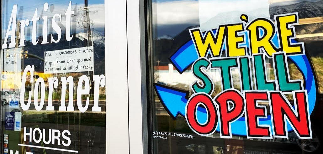 we're open sign Wonky Windows